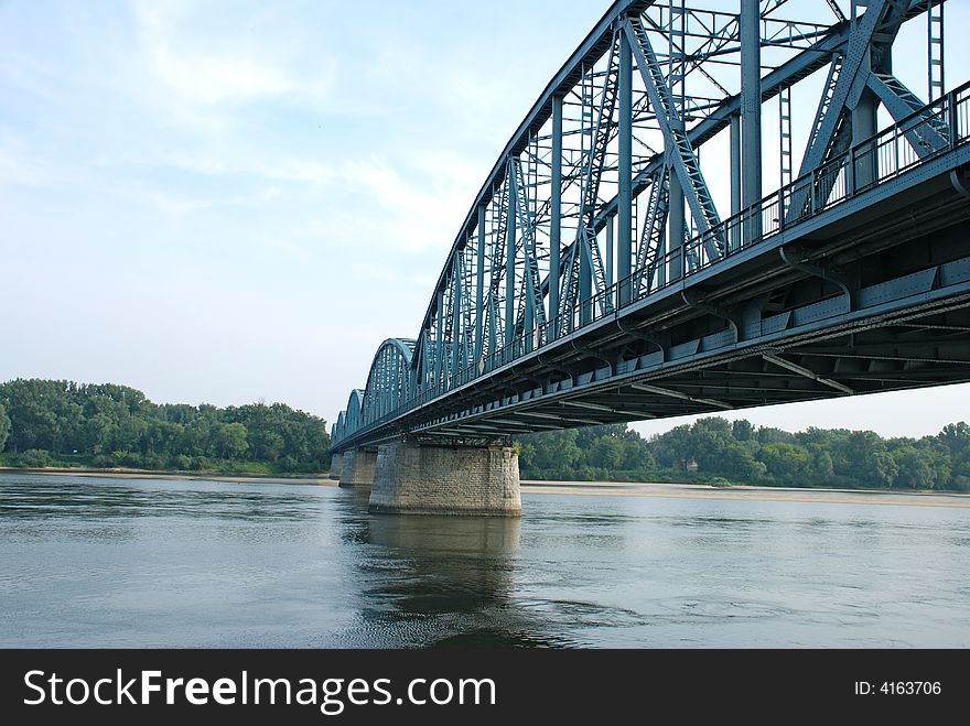 Large steel construction of bridge over a river. Large steel construction of bridge over a river.