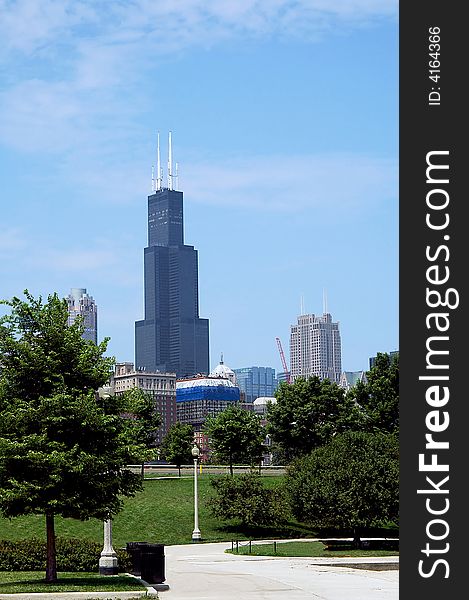 City park walkway with skyline in the background.