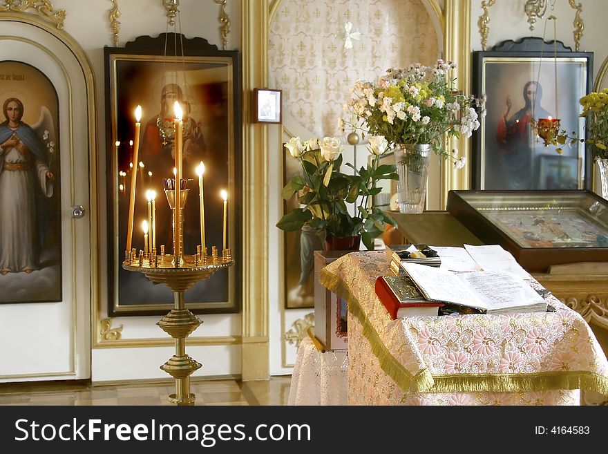 Church interior, altar, candles, bible
