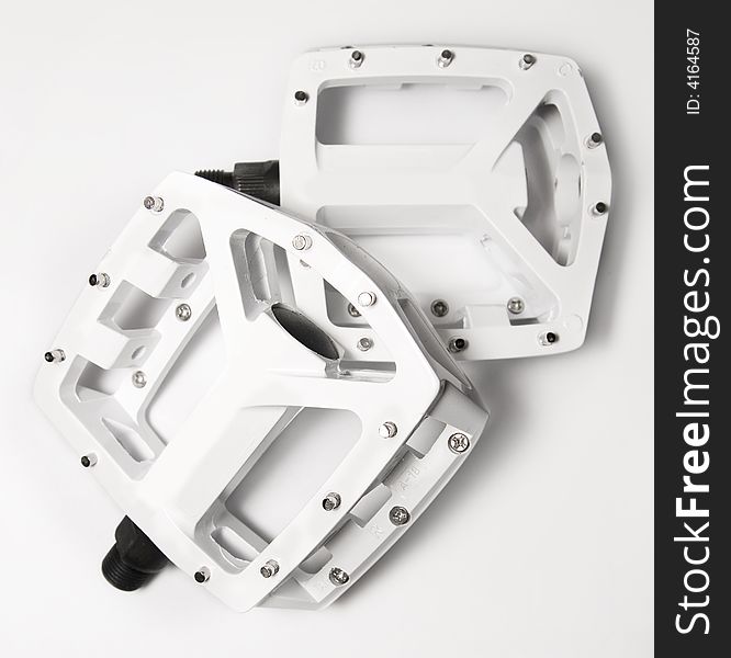 White bicycle platform pedals for extreme bike sports such as mountain biking, bicycle motocross etc.