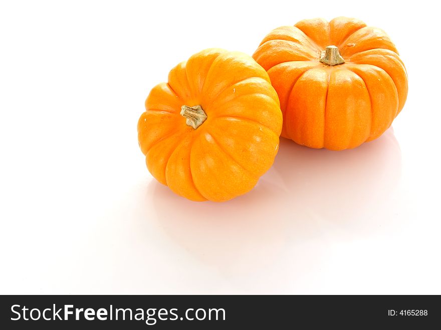 Orange pumpkins on white background.