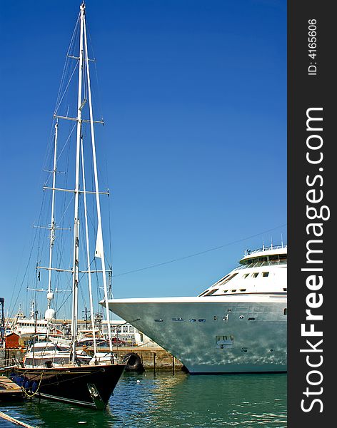 Ocean yacht near luxury passenger cruise liner at the port of cape town south africa