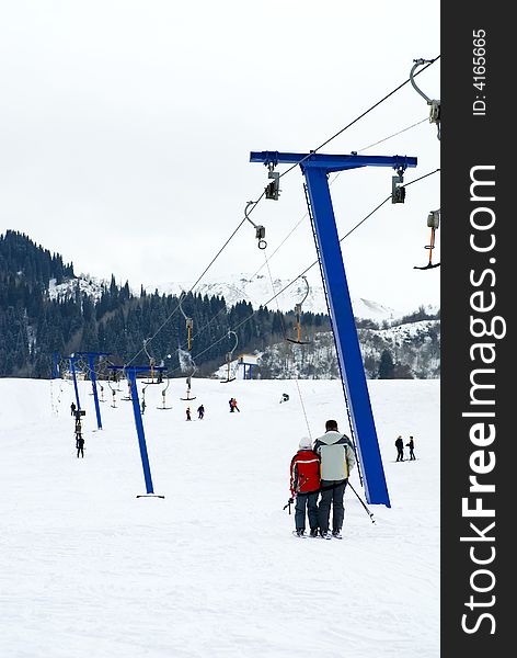 Skiers rise on the lift