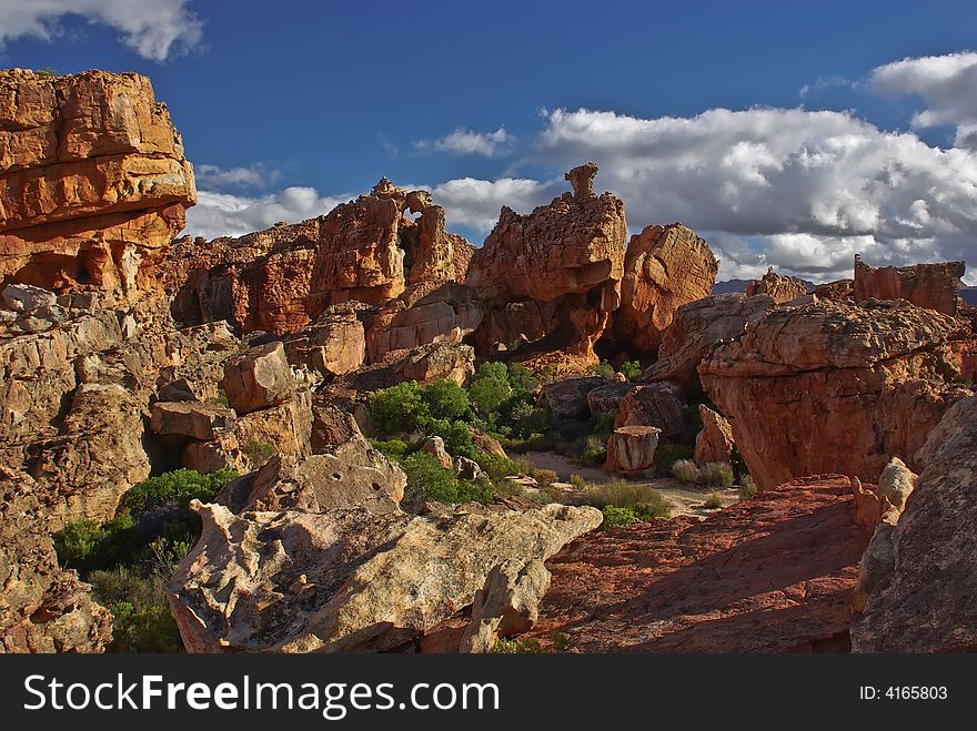 Red Cliff And Stone In Desert