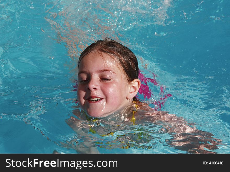 Girl having fun just floating in a pool. Girl having fun just floating in a pool