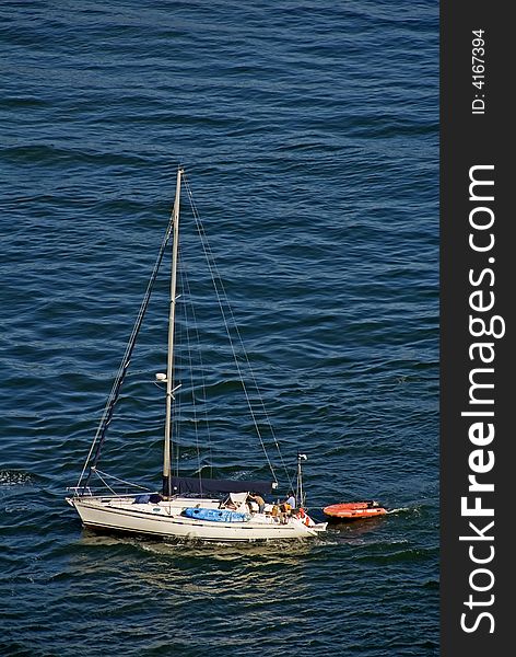 A lone Yacht leaving for next leg of trip around the world. A lone Yacht leaving for next leg of trip around the world