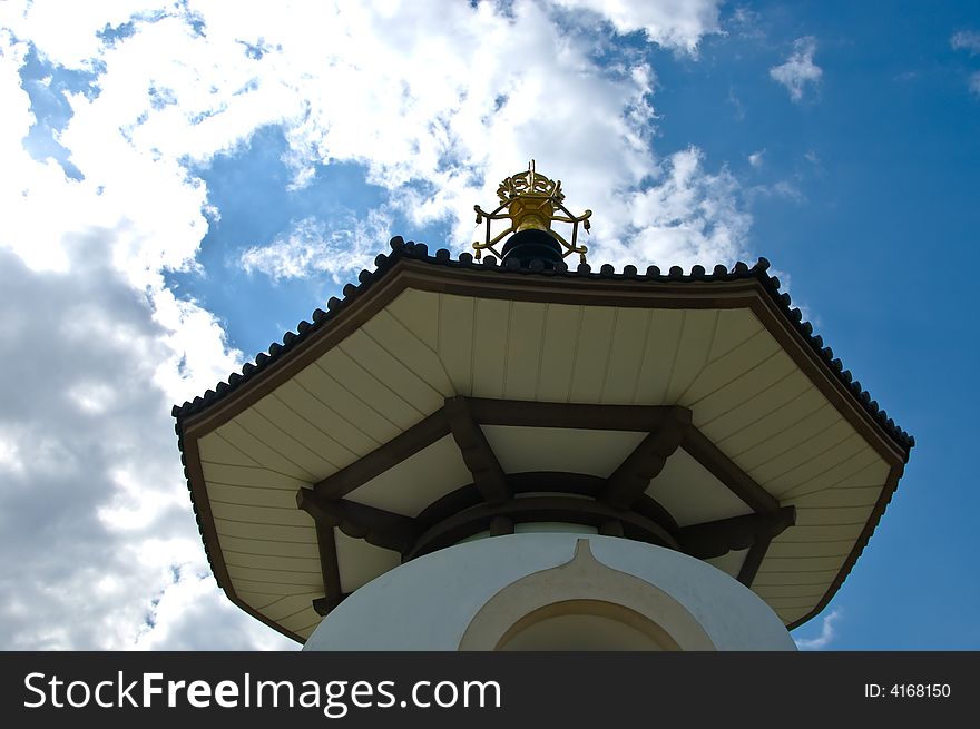 Buddhist peace pagoda against a blue sky