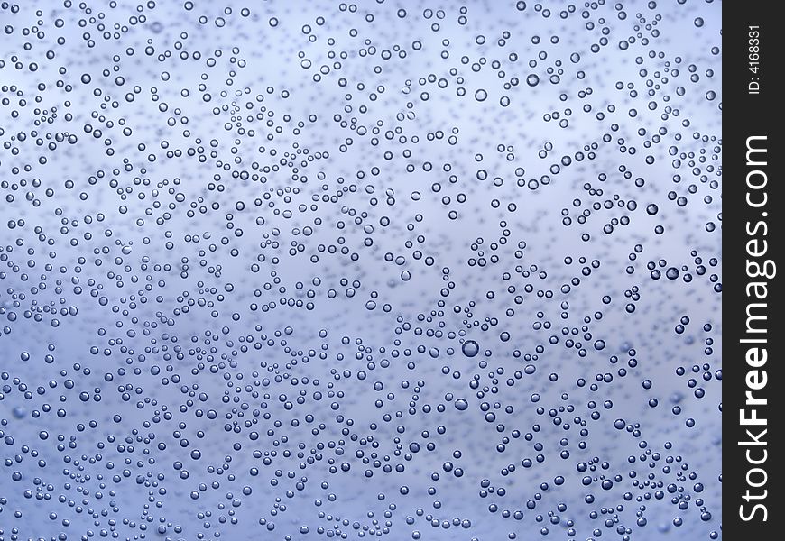 Bubbles of air on the glass inside water environs