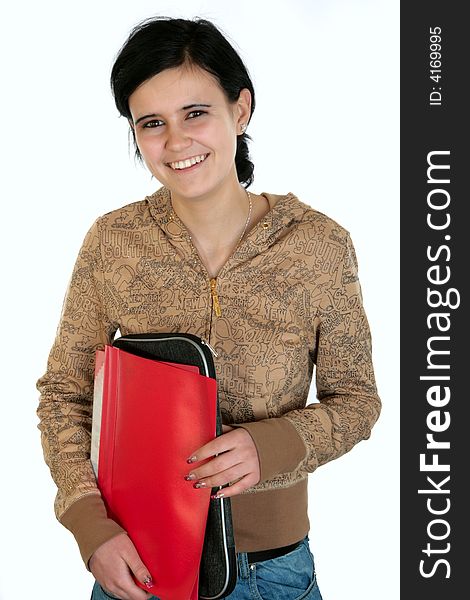 A smiling schoolgirl with black hair and with files. A smiling schoolgirl with black hair and with files