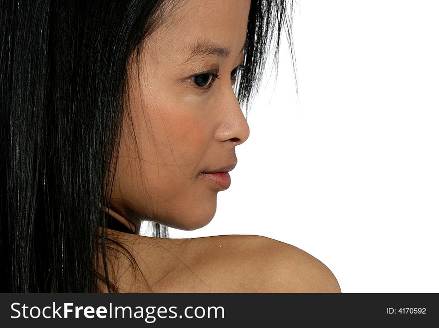Portrait of attractive young Asian woman looking over her shoulder. Portrait of attractive young Asian woman looking over her shoulder