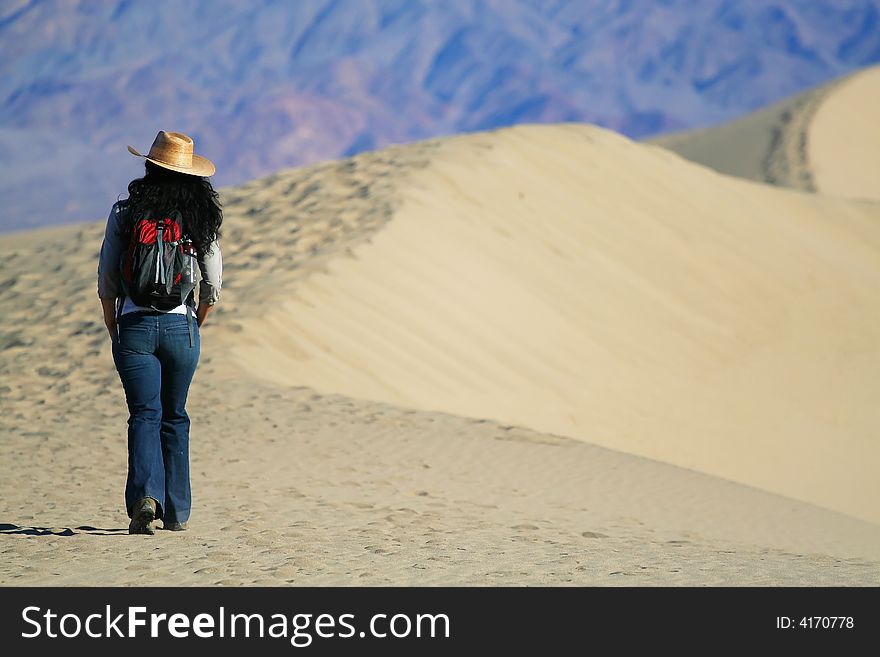 A girl hikes in the desert. A girl hikes in the desert