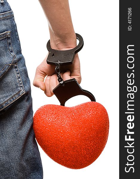 Man hand with handcuffs and heart