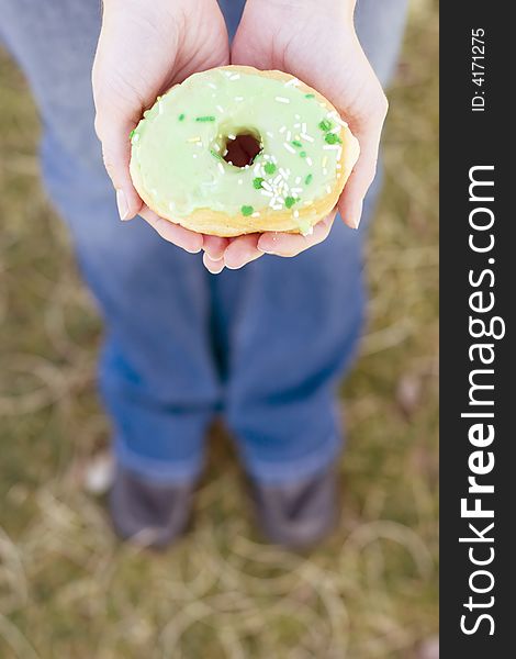 High-angle view of woman holding donut in hands