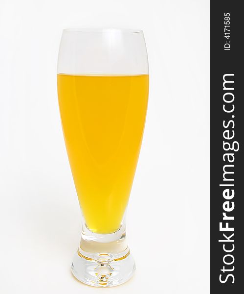 Only orange juice in high glass over white background. Only orange juice in high glass over white background