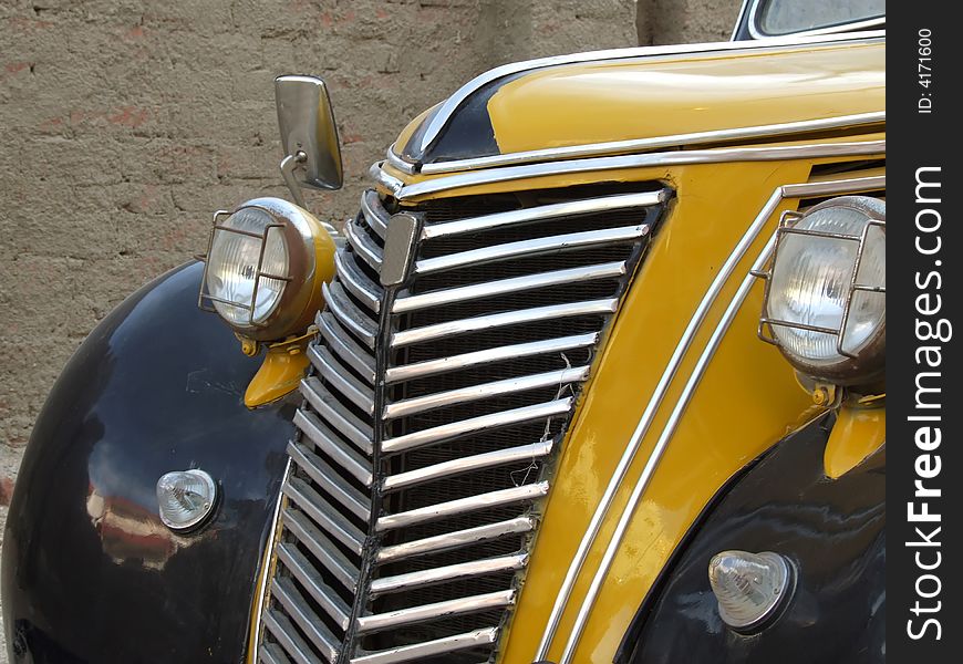 Radiator of old yellow car