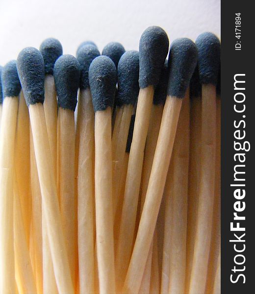The picture shows a gathering of matches with blue head. The picture shows a gathering of matches with blue head