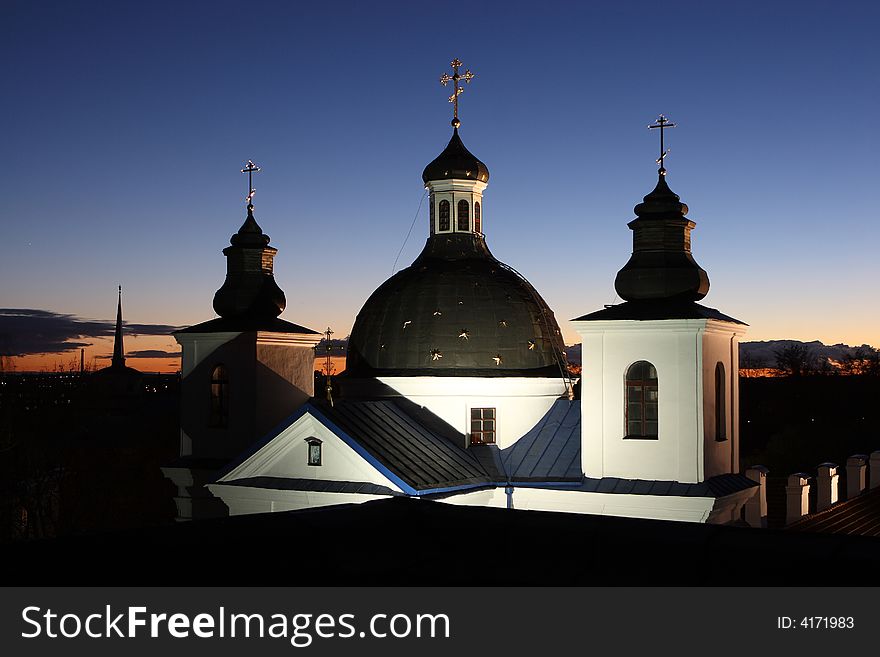 Orthodox temple with illumination on a background of a decline. Orthodox temple with illumination on a background of a decline