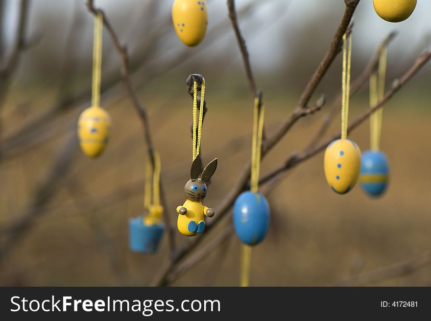 Easter ornaments on tree outside