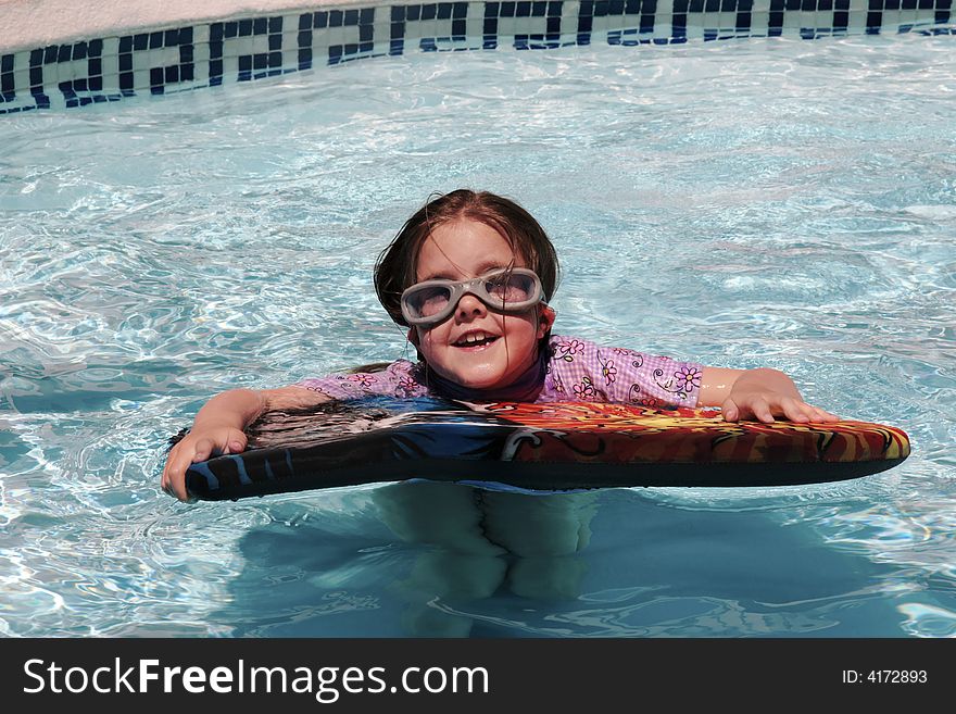 Girl having fun just floating in a pool. Girl having fun just floating in a pool