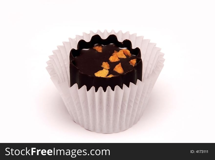 Delicious chocolate sweet on the white background. Delicious chocolate sweet on the white background