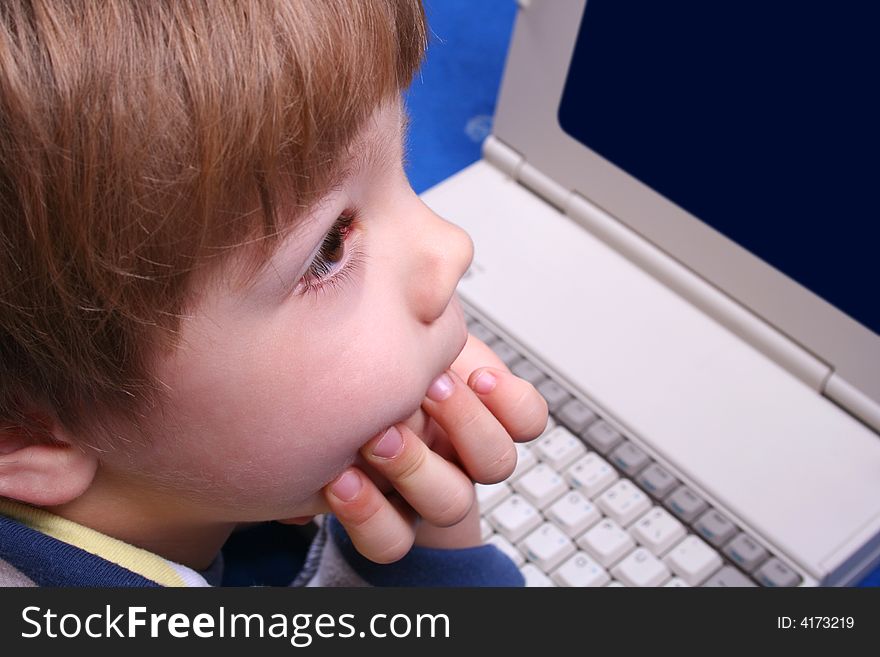 Young boy using a laptop