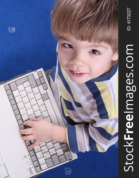 Young boy using a laptop