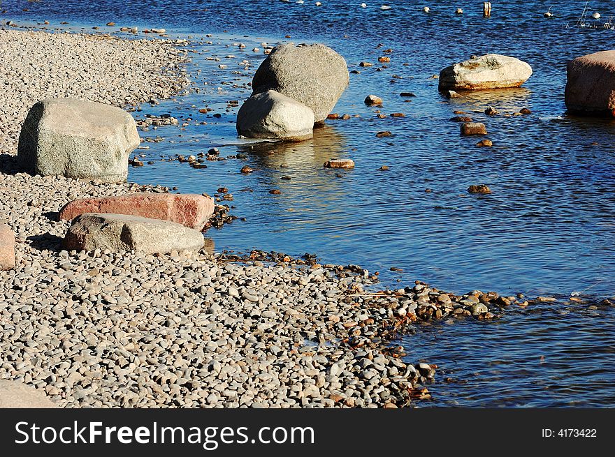 Stones on the winter lake shore