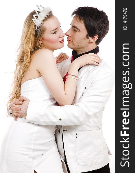 The pair embraces in white clothes