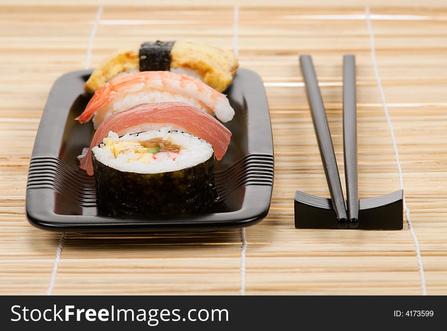 Assortment of sushi on a bamboo mat