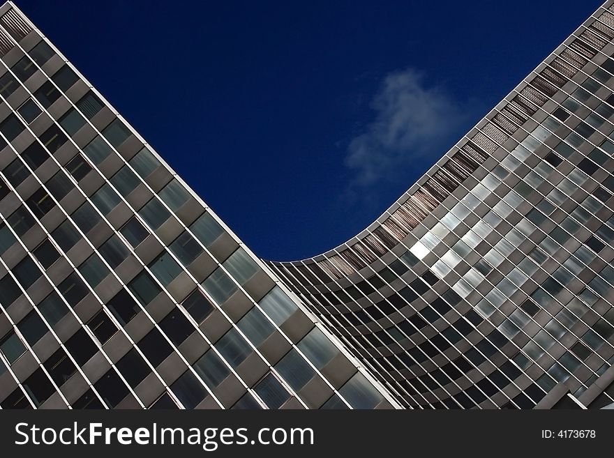 Modern skyscraper against the dark blue sky