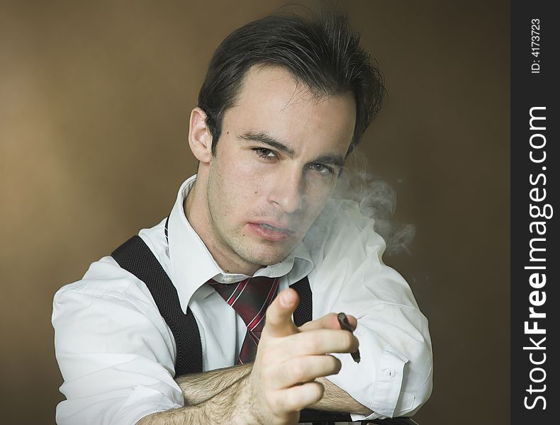 Smoking the man on a dark background. Smoking the man on a dark background