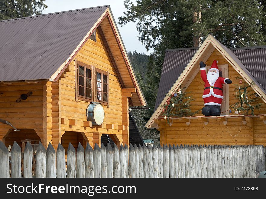 Wooden cottages amongst pine-nedles wood