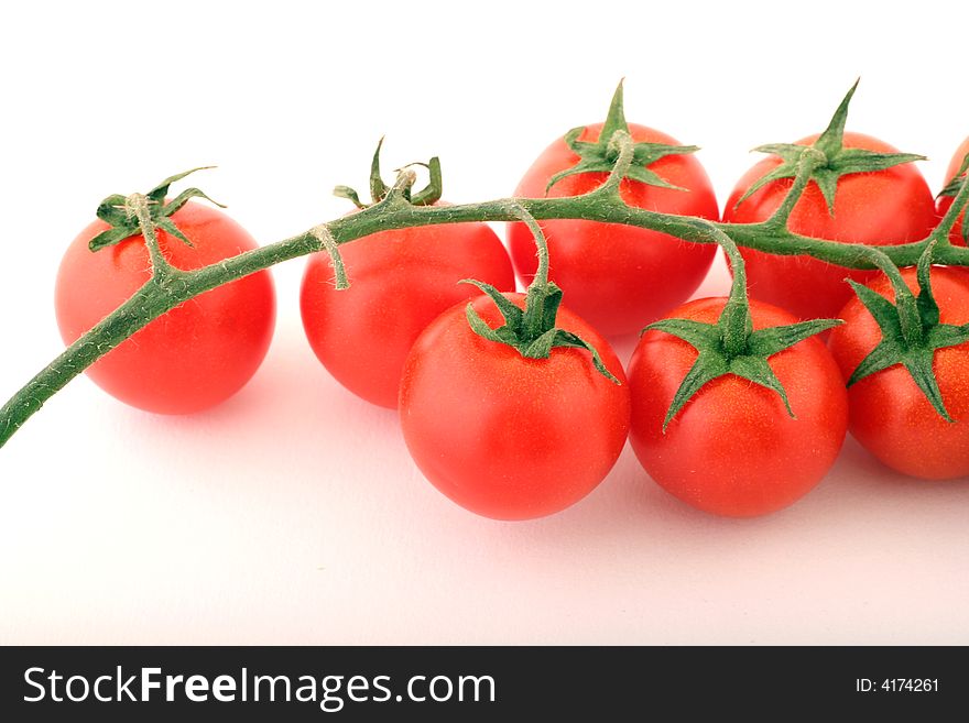Cherry Tomatoes on a withe background.