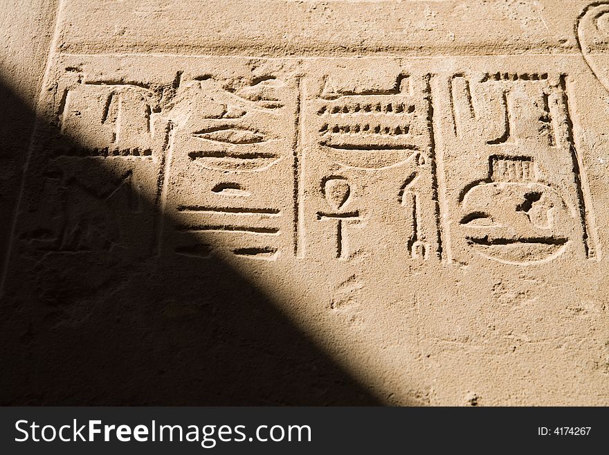 A photo of ancient egyptian script in Luxor, Egypt. A photo of ancient egyptian script in Luxor, Egypt