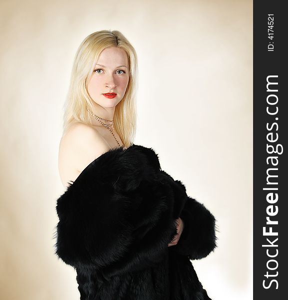 Sexy blond girl dressed in fur. Sexy blond girl dressed in fur