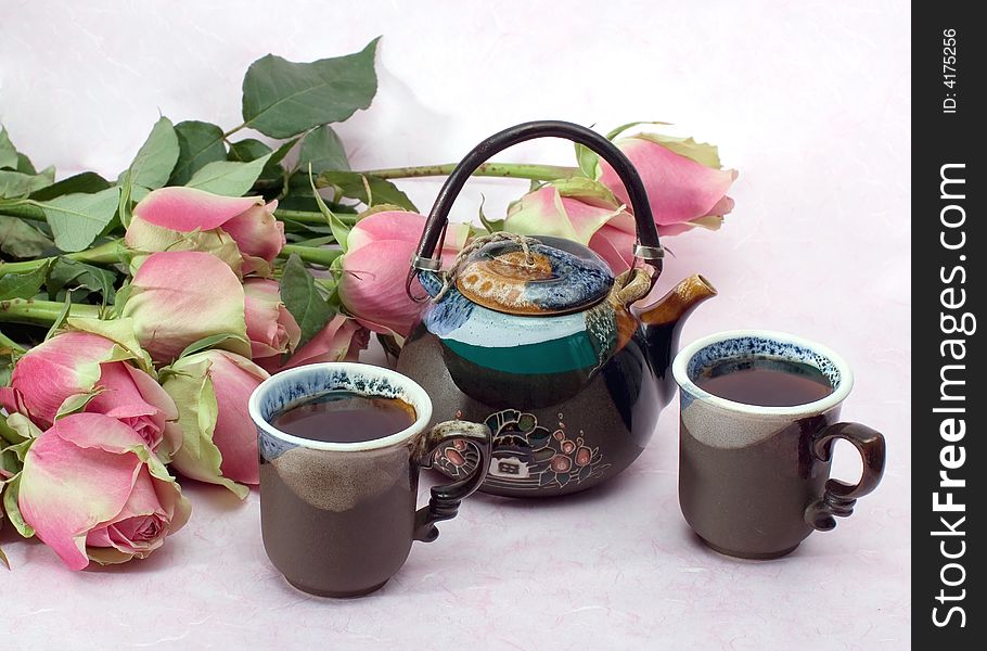 Still-life with  roses and black tea on pink background. Still-life with  roses and black tea on pink background.