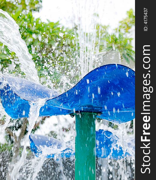 Fountain splashing and creating a wet misty environment in a children's water playground. Fountain splashing and creating a wet misty environment in a children's water playground