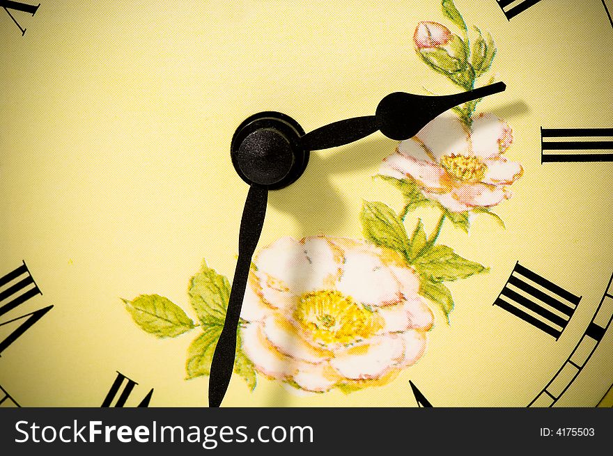 Antique clock-face with flowers