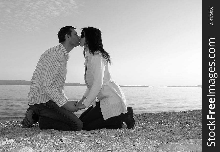 Couple kissing in front of the Mediterranean Sea. Couple kissing in front of the Mediterranean Sea