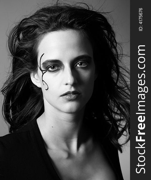 It is black a white portrait of the beautiful woman with an original make-up. It is black a white portrait of the beautiful woman with an original make-up