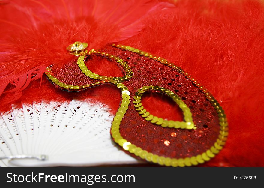 Close up of red feathered mask