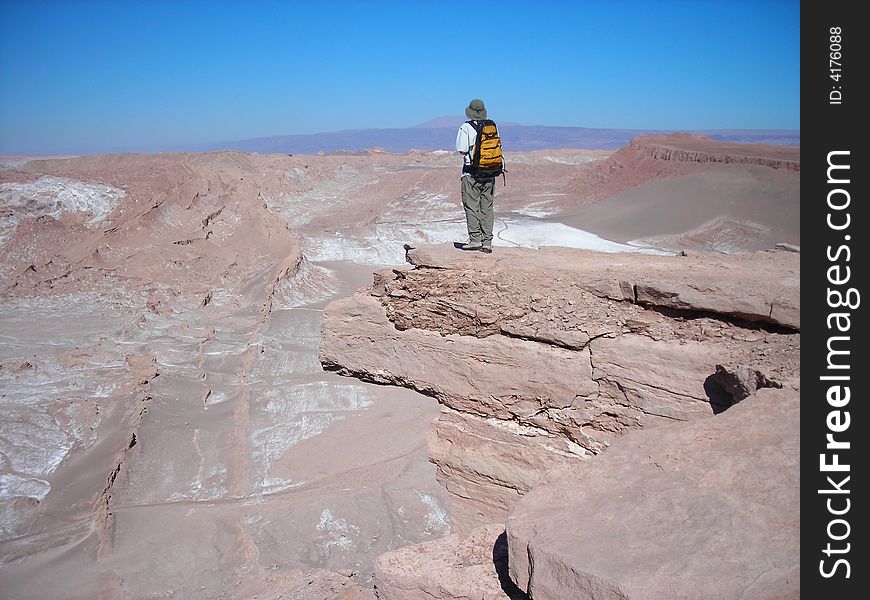 Man standing on top of Kari Canyon in the Atacama Desert, Chile, March 2006. Man standing on top of Kari Canyon in the Atacama Desert, Chile, March 2006.