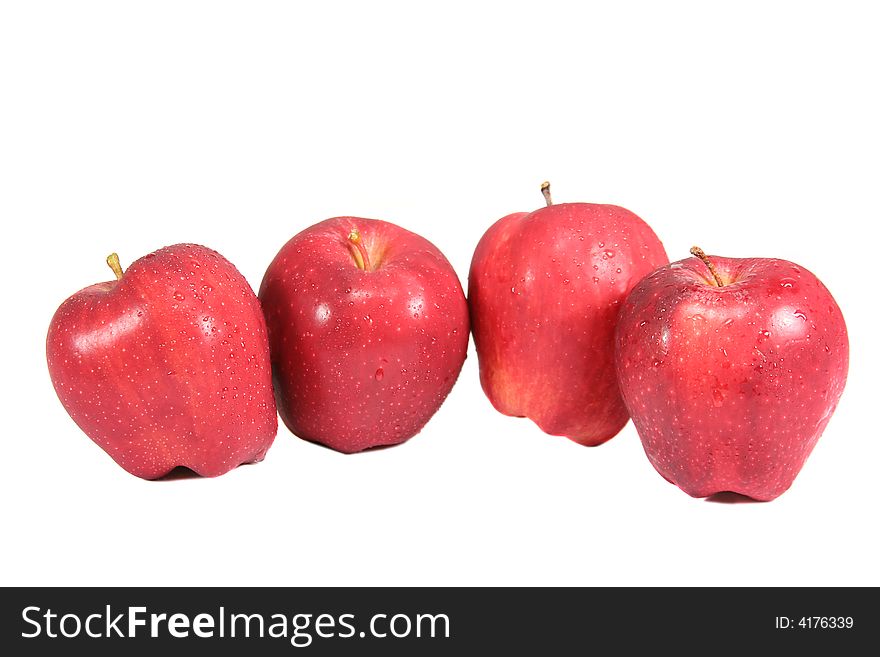 Four red apples isolated on white