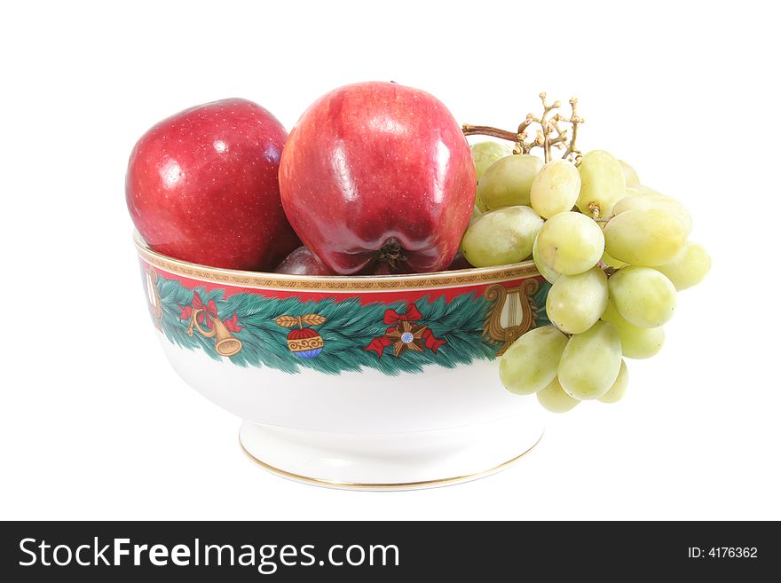 Fruits inside a christmas ornamental bowl. Fruits inside a christmas ornamental bowl