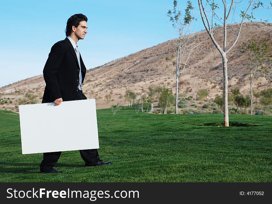 Businessman Holding Blank Board