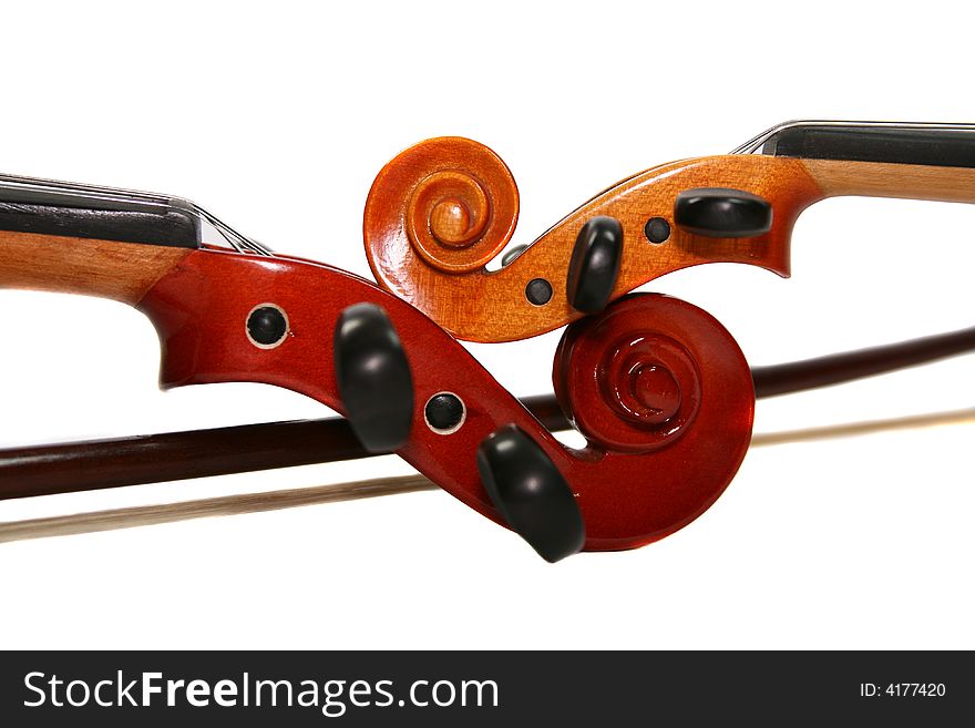 Two violins isolated on a white background. A fragment