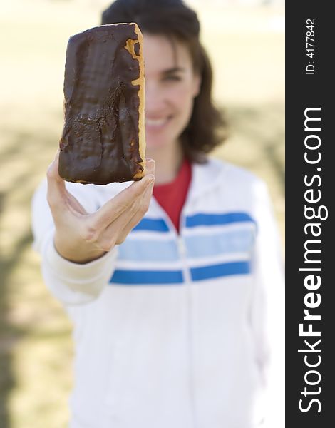 Woman Holding Up Donut