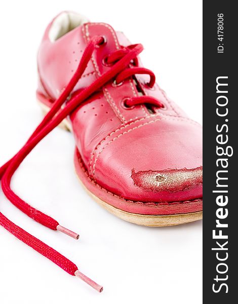 Damaged red shoes caused by kicking stones. Damaged red shoes caused by kicking stones