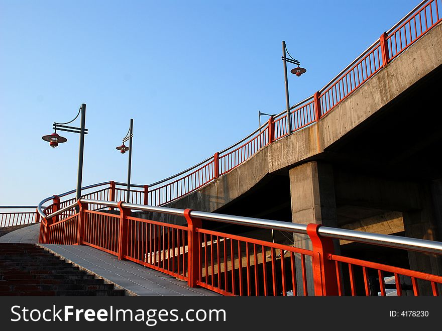 Street lamps,railings and footbridge backgrouded with blue sky in sunny day. Street lamps,railings and footbridge backgrouded with blue sky in sunny day.