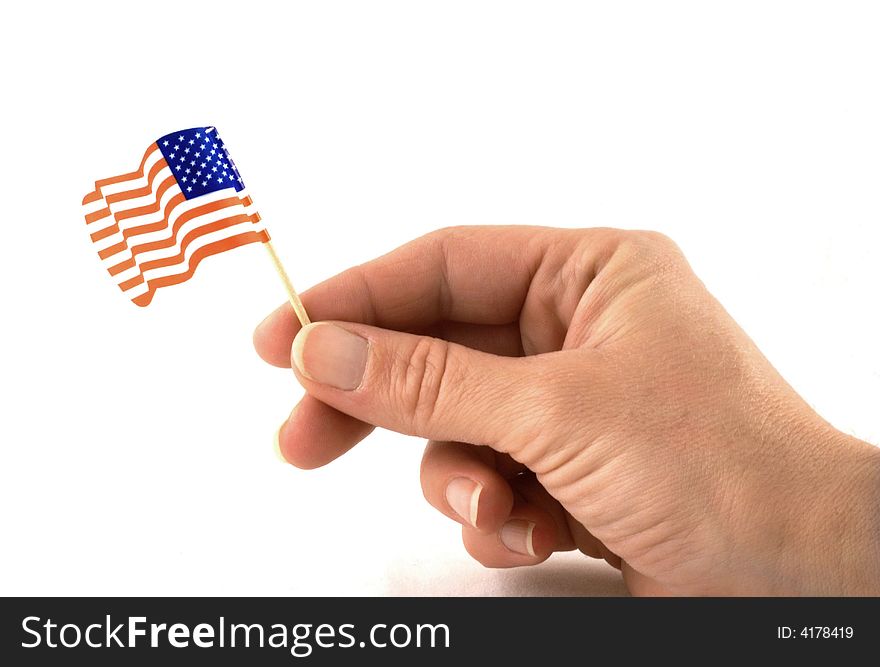 Hand with little american flag isolated on white. Hand with little american flag isolated on white.